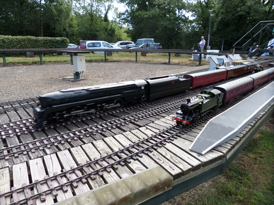 'J' Class roars past a waiting GWR Prairie