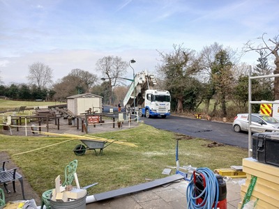 The first of the wagons delivering the tarmac